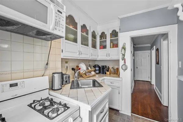 a kitchen with stainless steel appliances granite countertop a sink and cabinets