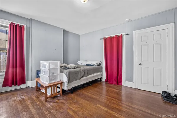 a bed room with a bed and a chair