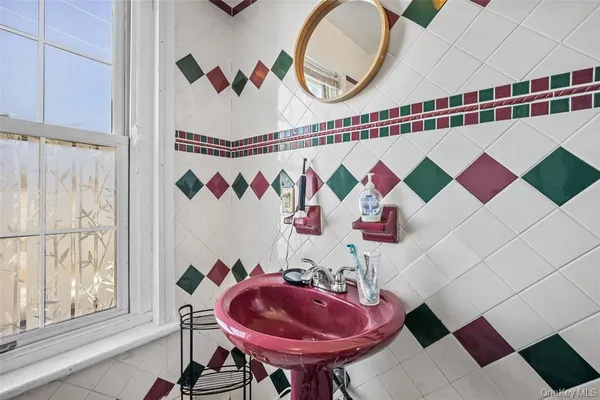 a bathroom with a sink and mirror