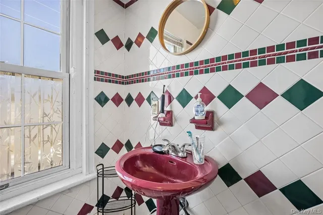 a bathroom with a sink and mirror