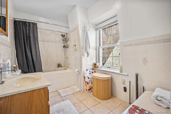 a bathroom with a sink a toilet and a bathtub