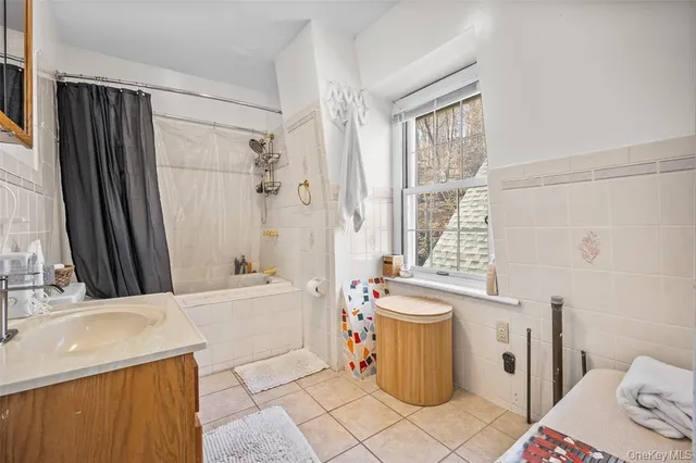 a bathroom with a sink a toilet and a bathtub