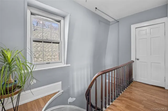 a view of entryway with wooden floor