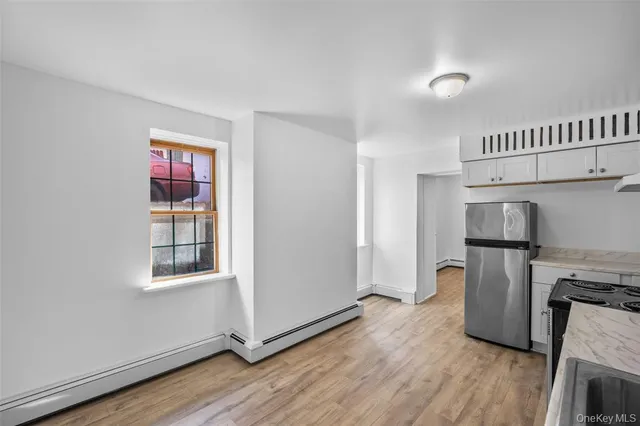 a kitchen with a refrigerator a washer and dryer