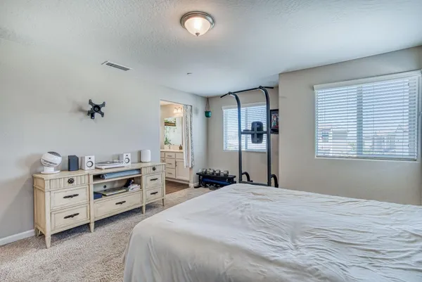 a bedroom with a bed and a dresser