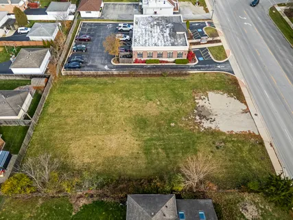 a view of a swimming pool with a yard