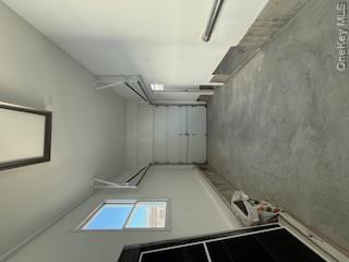 733 East Walnut Street, Unit UPPR Long Beach, NY 11561 - Photo 18 of 26 a view of a room with an empty space