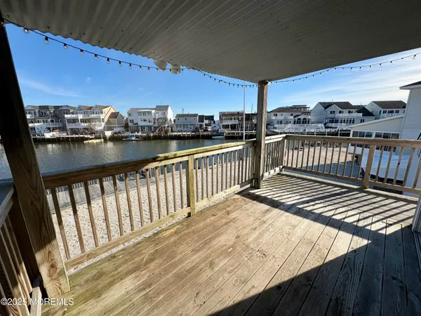 a view of balcony with wooden floor