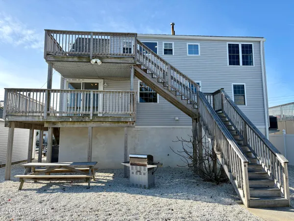 a view of staircase with a table and chairs