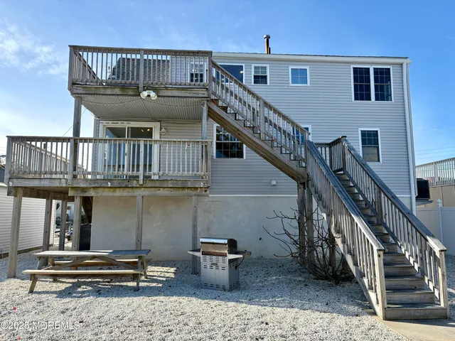 a view of staircase with a table and chairs