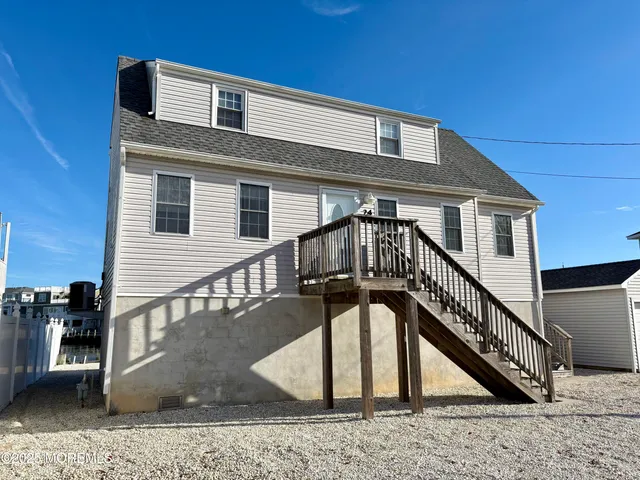 a view of a house with a small yard