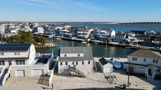 an aerial view of a house with lake view