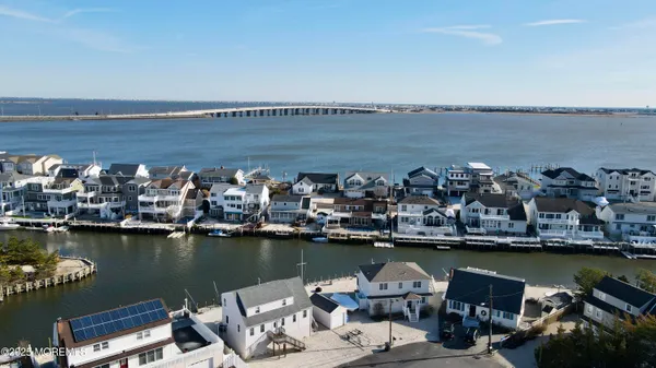 a view of a ocean with boats and trees in ocean