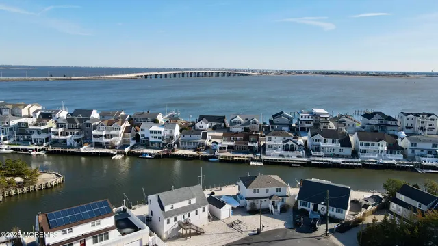 a view of a ocean with boats and trees in ocean