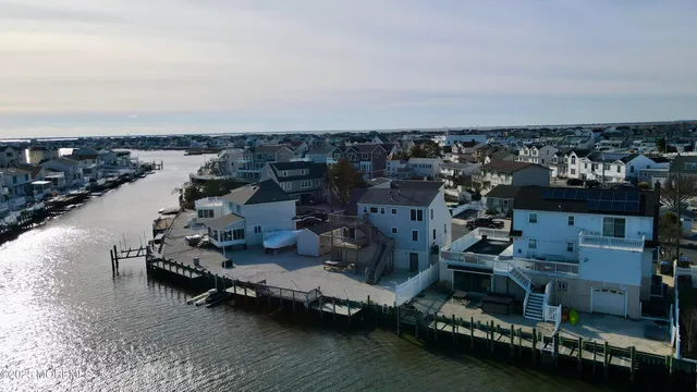 an aerial view of a house with a ocean view