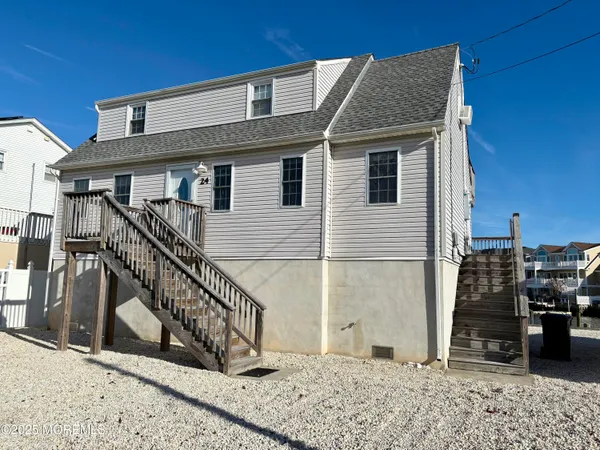 a view of a house with wooden stairs