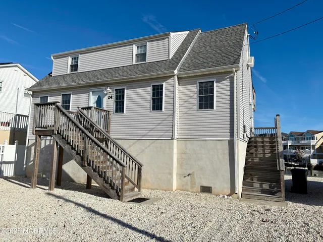 a view of a house with wooden stairs