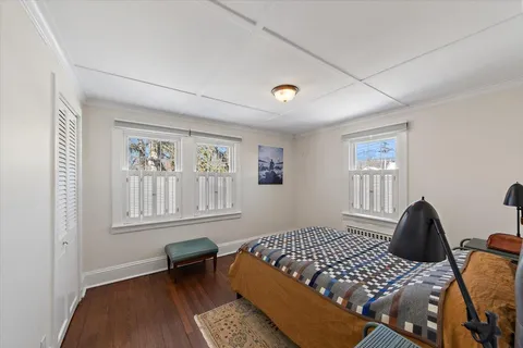a bedroom with furniture and a window