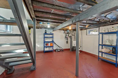 a view of an empty room with stairs