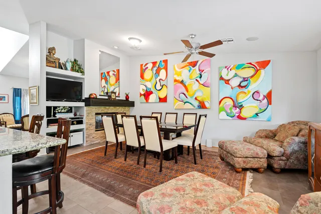 a bedroom with furniture and a wooden floor