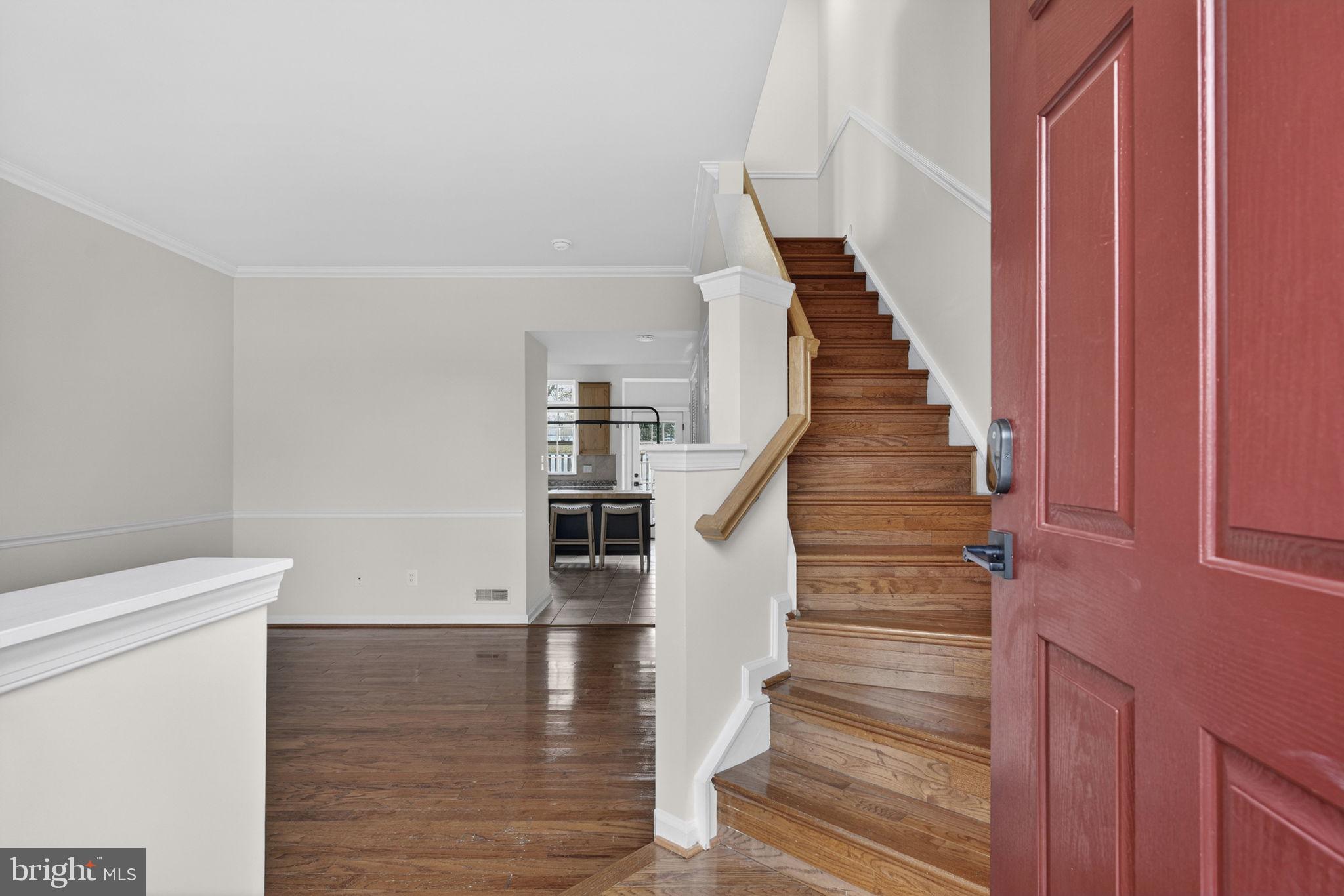 6741 Stone Maple Terrace Centreville, VA 20121 - Photo 2 of 24 a view of entryway and hall with wooden floor