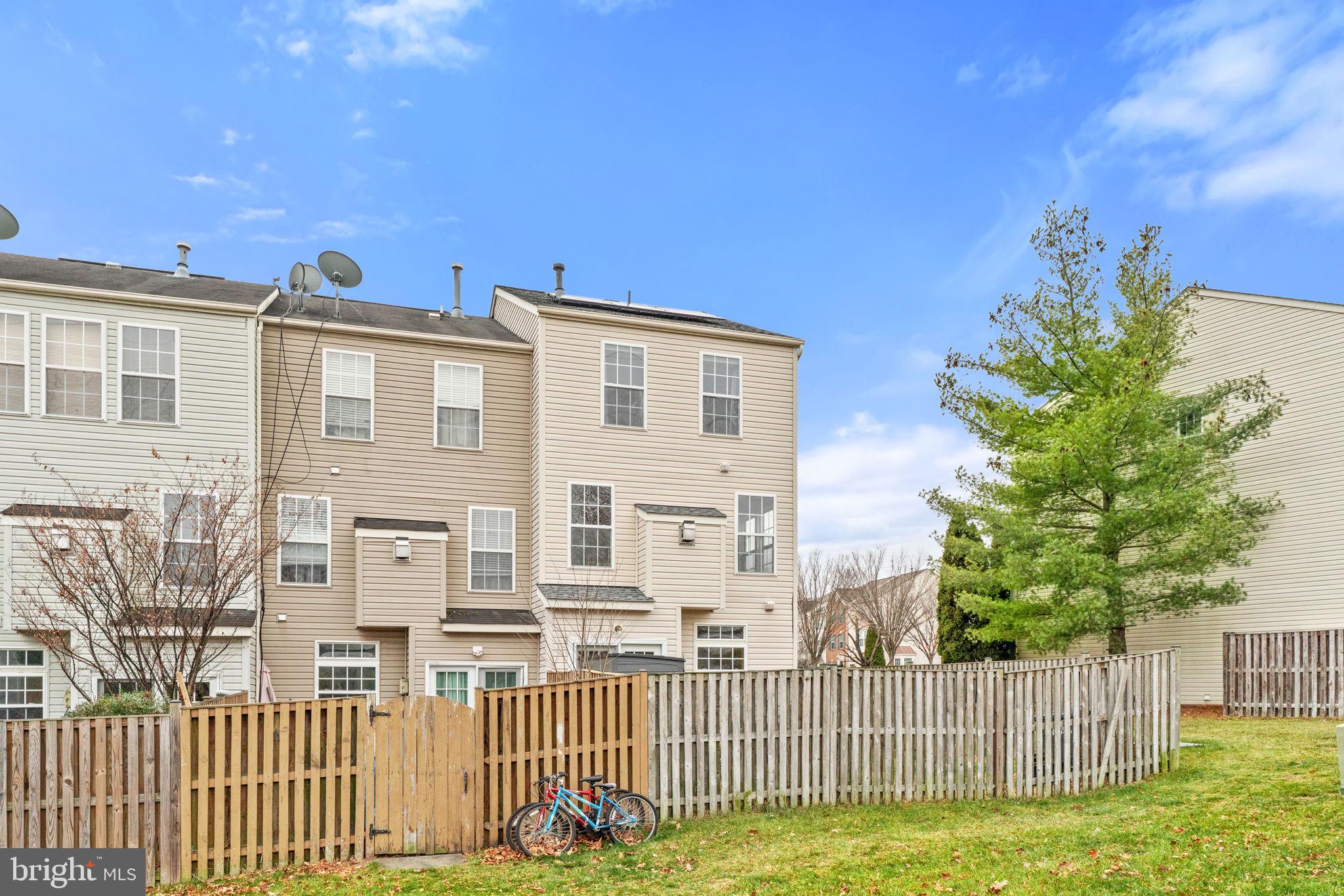 6741 Stone Maple Terrace Centreville, VA 20121 - Photo 23 of 24 a front view of a house with a garden