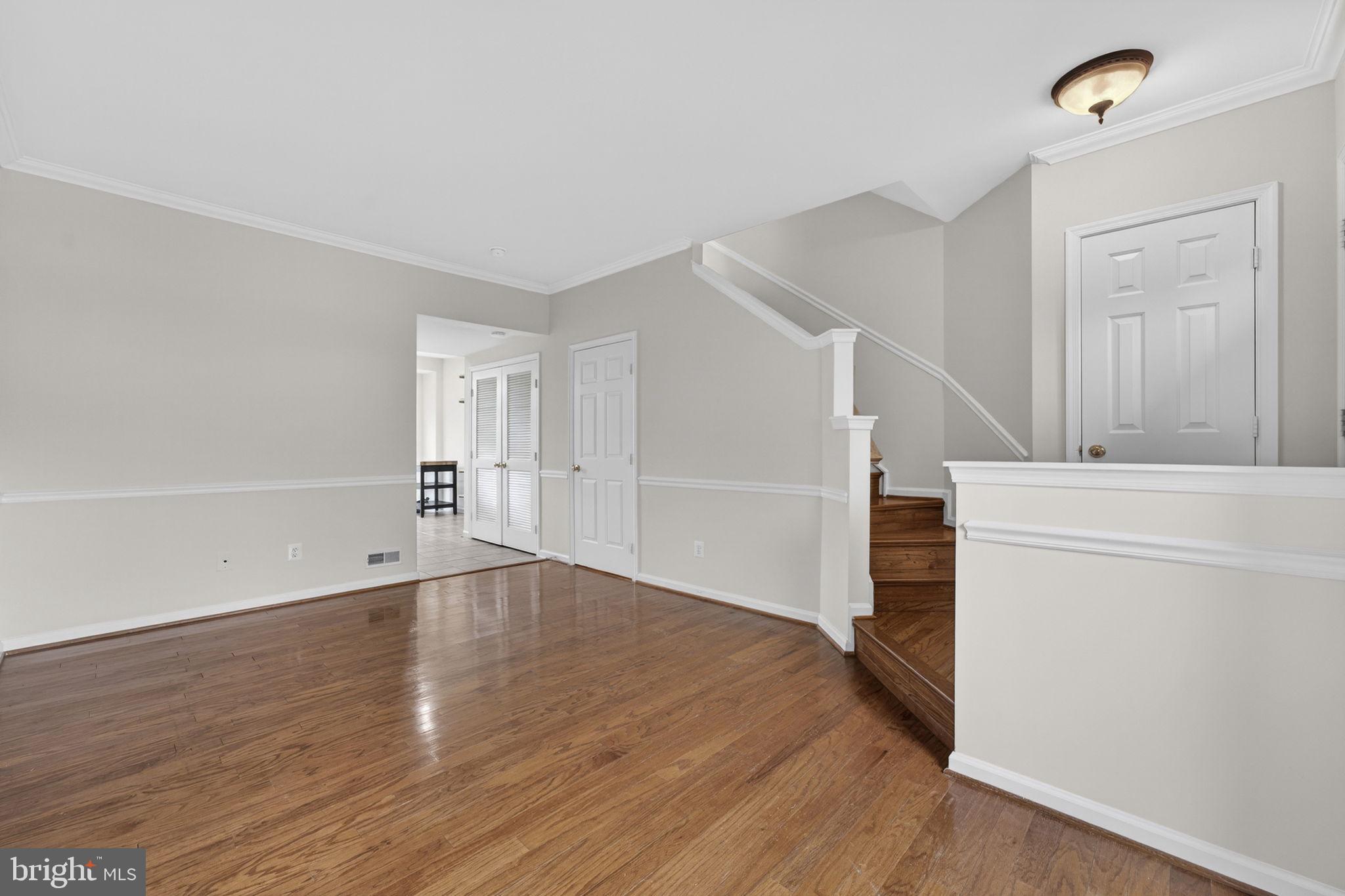 6741 Stone Maple Terrace Centreville, VA 20121 - Photo 3 of 24 wooden floor in an empty room