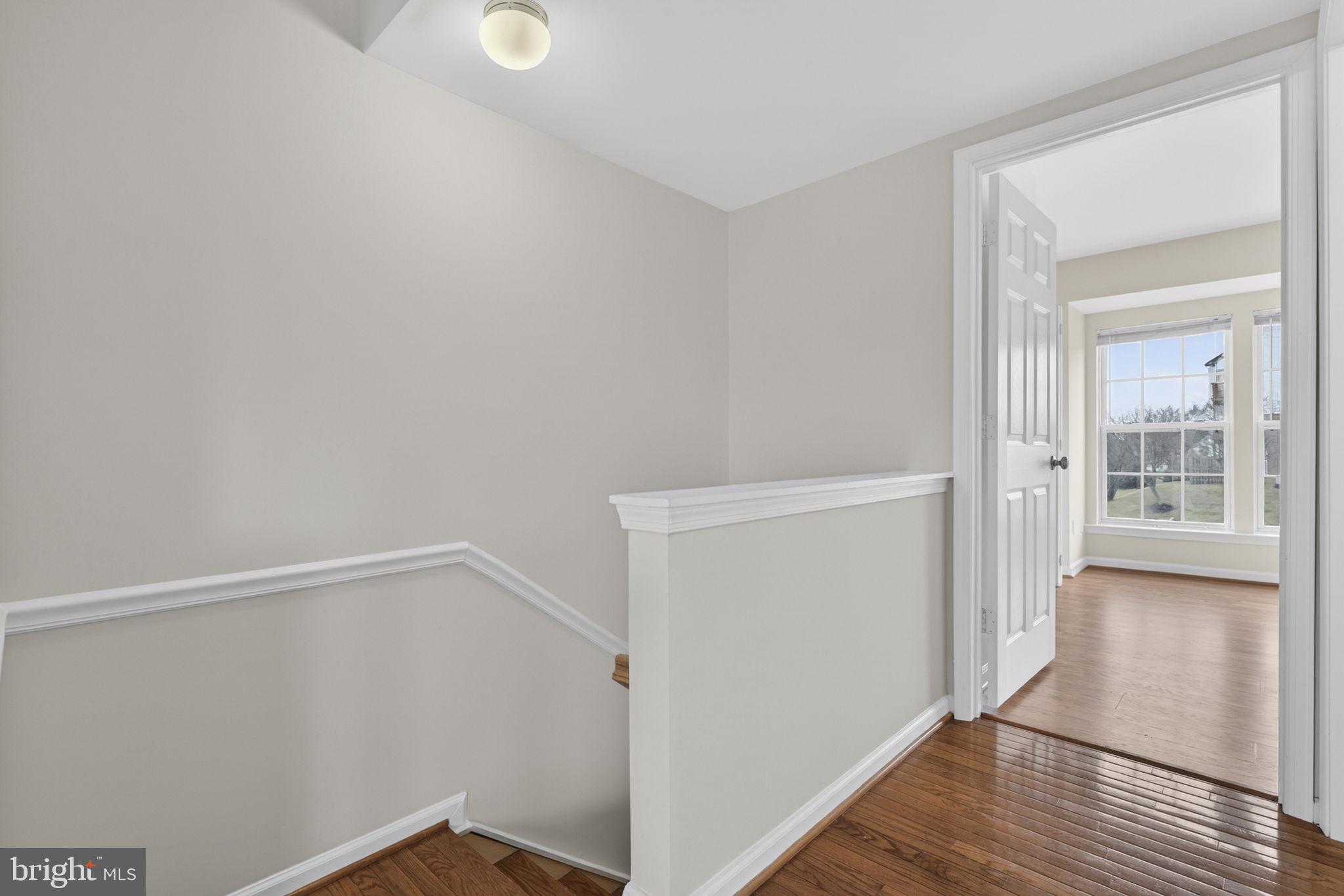 6741 Stone Maple Terrace Centreville, VA 20121 - Photo 10 of 24 a view of an empty room with wooden floor