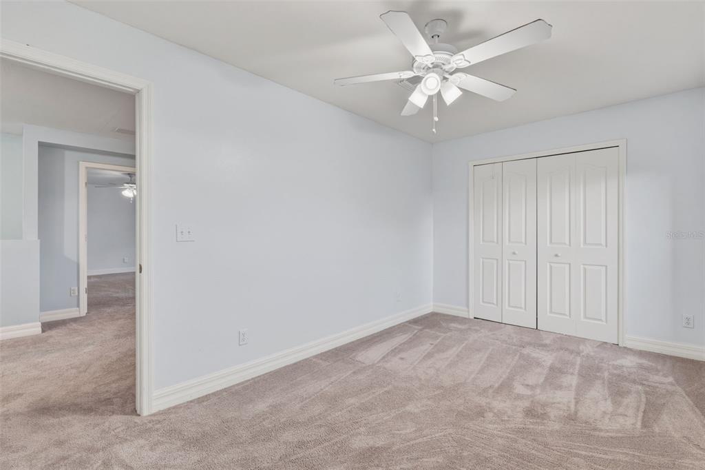 25134 Palisade Road Punta Gorda, FL 33983 - Photo 35 of 58 a view of an empty room and chandelier fan