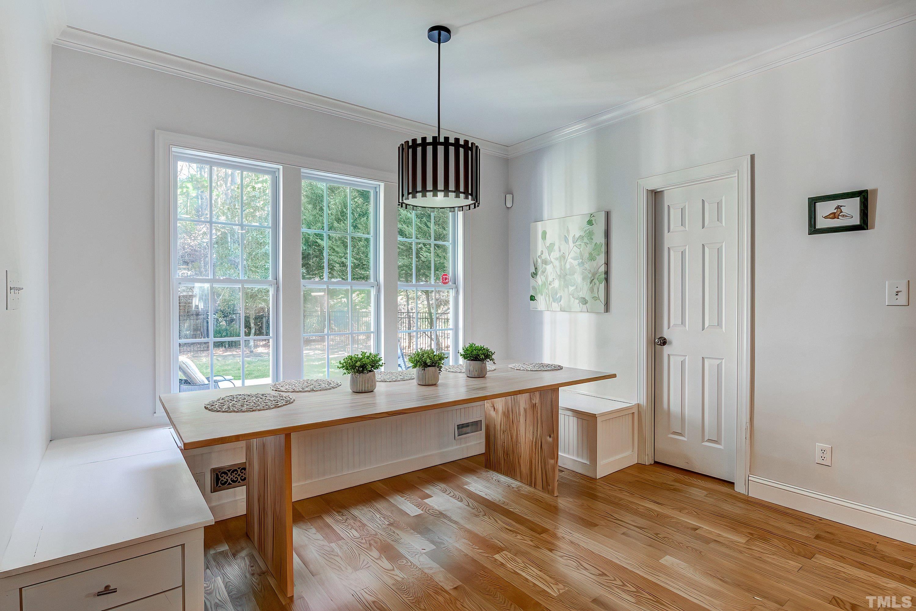 1613 Strategy Way Wake Forest, NC 27587 - Photo 16 of 58 a room with wooden floor and windows