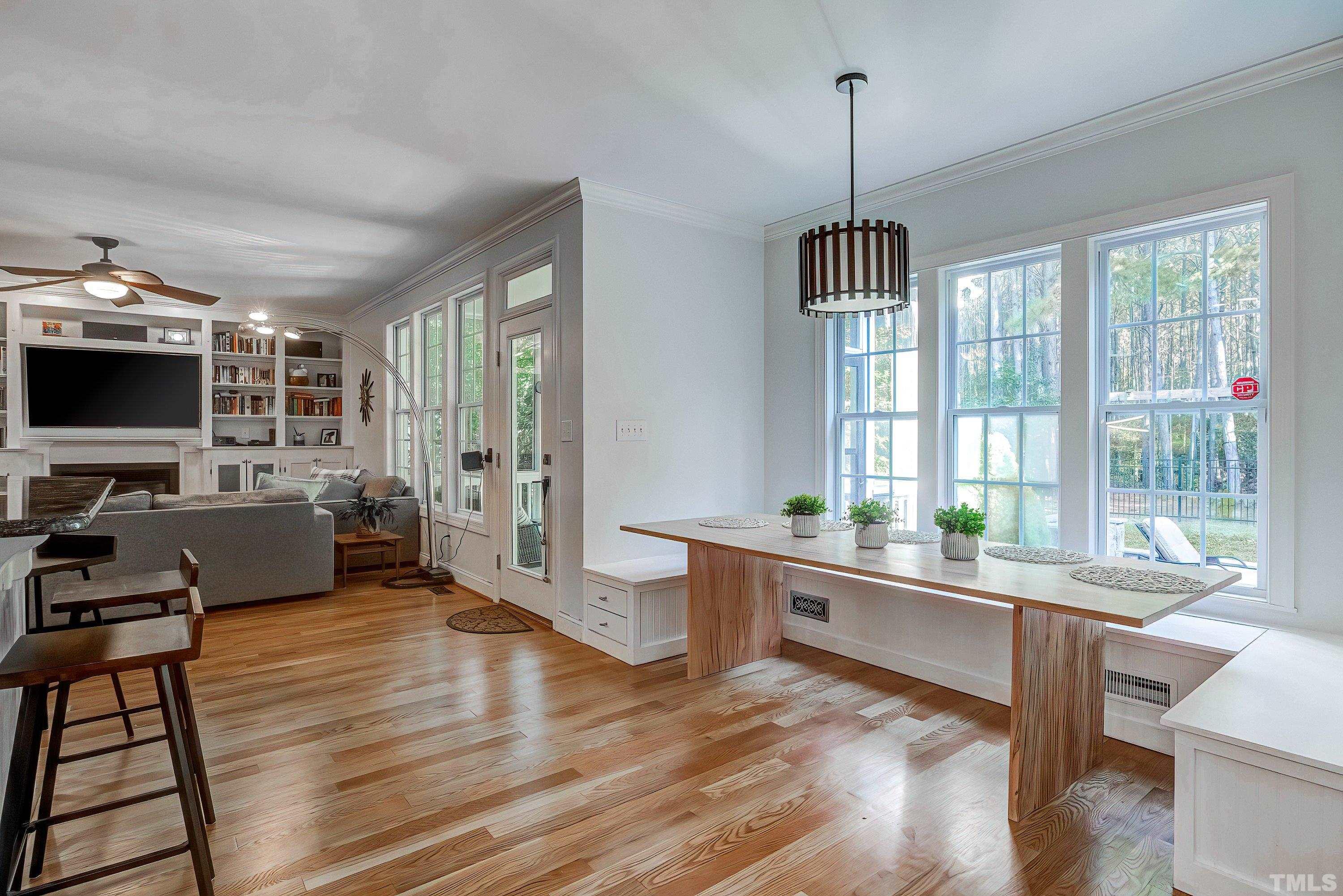 1613 Strategy Way Wake Forest, NC 27587 - Photo 18 of 58 a room with lots of furniture and windows