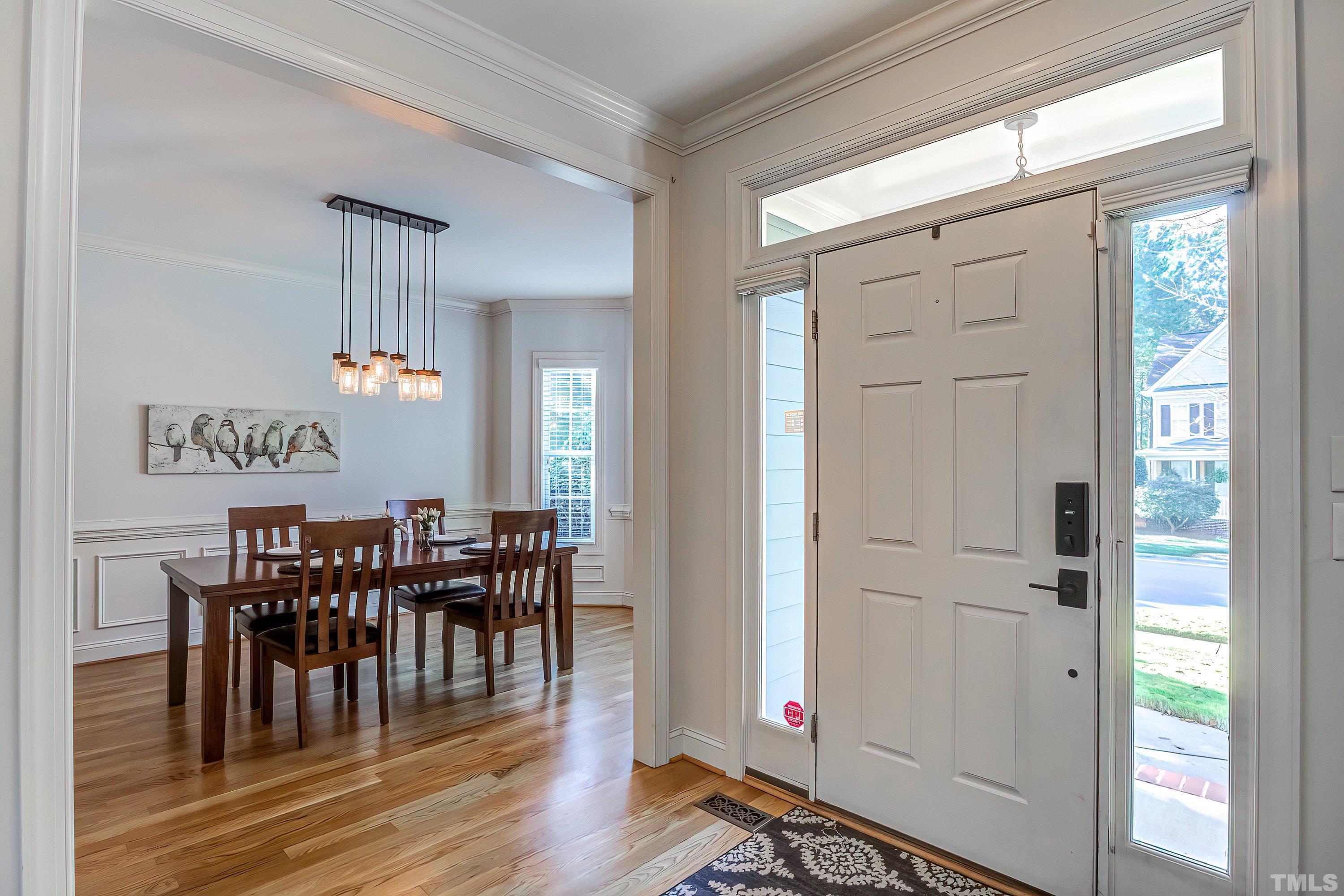 1613 Strategy Way Wake Forest, NC 27587 - Photo 3 of 58 a view of a dining room with furniture window and wooden floor