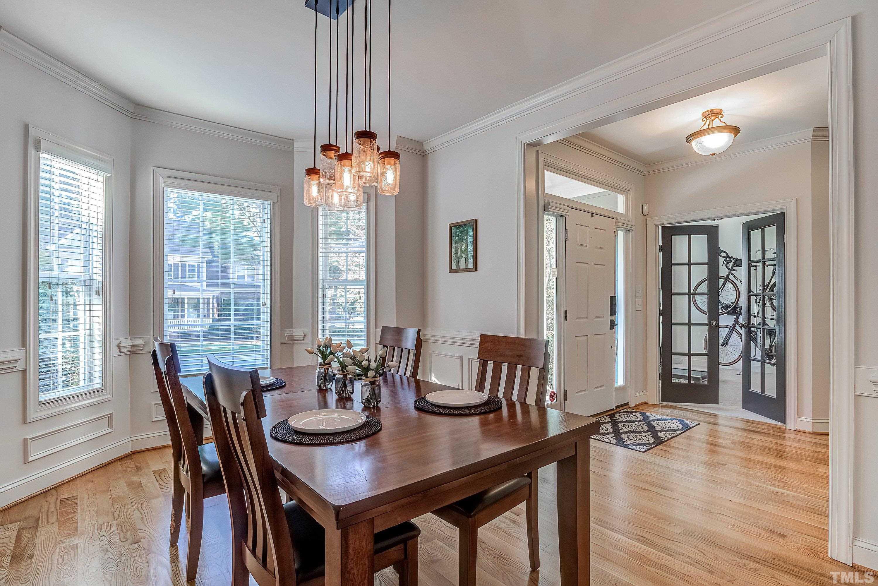 1613 Strategy Way Wake Forest, NC 27587 - Photo 4 of 58 a view of a dining room with furniture window and wooden floor