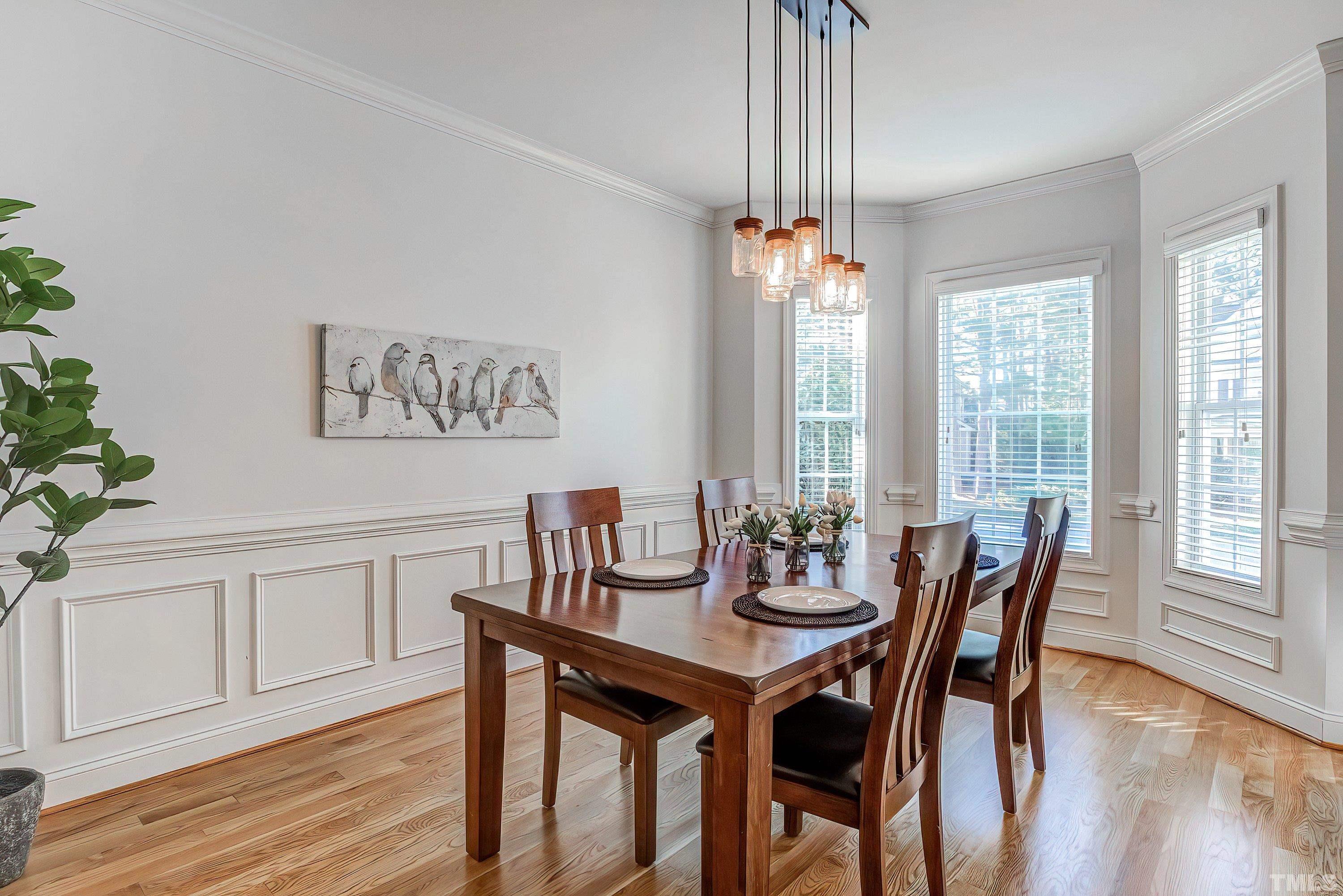 1613 Strategy Way Wake Forest, NC 27587 - Photo 5 of 58 a view of a dining room with furniture window and wooden floor