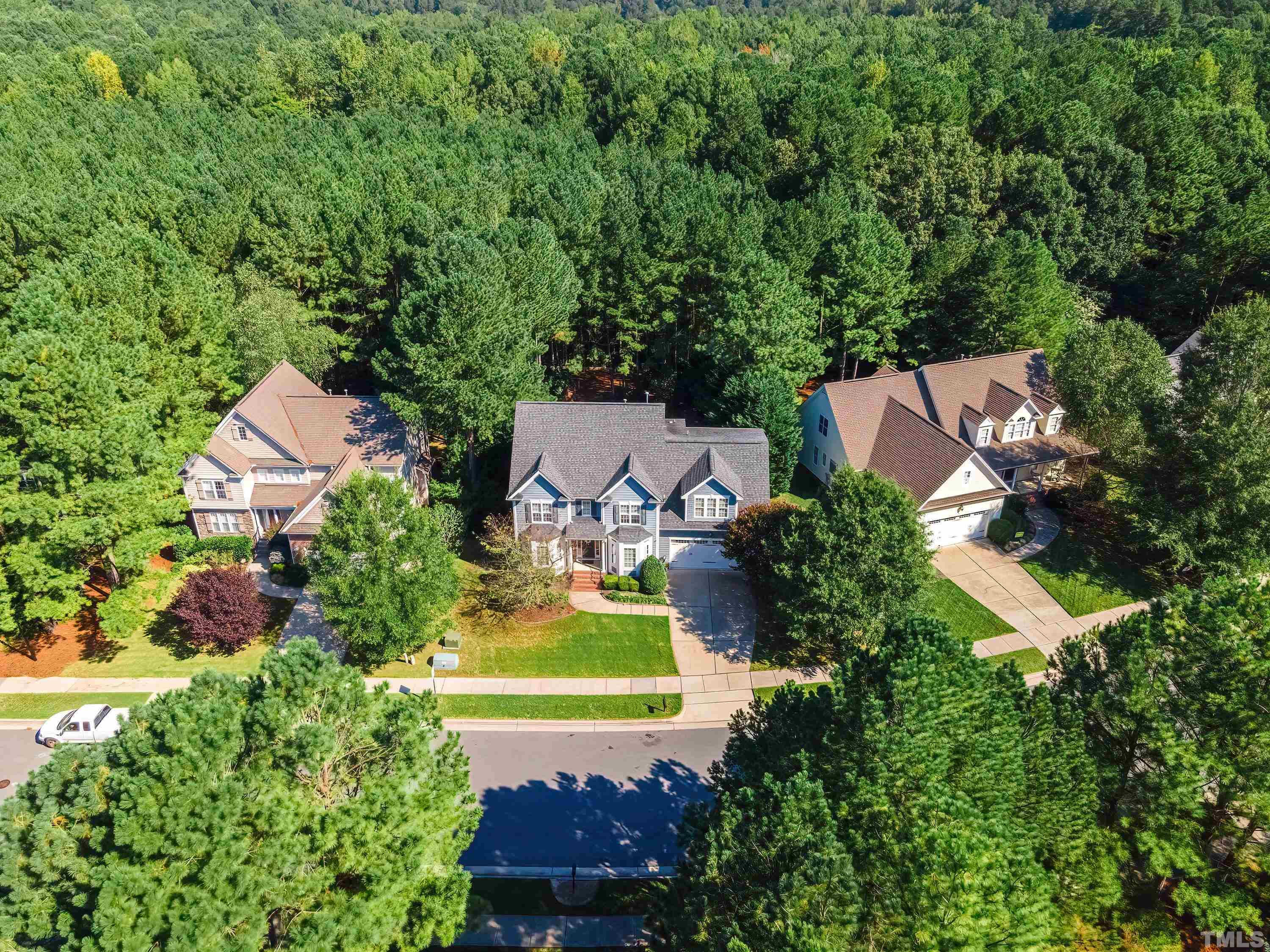 1613 Strategy Way Wake Forest, NC 27587 - Photo 53 of 58 an aerial view of a house with swimming pool a yard and a house