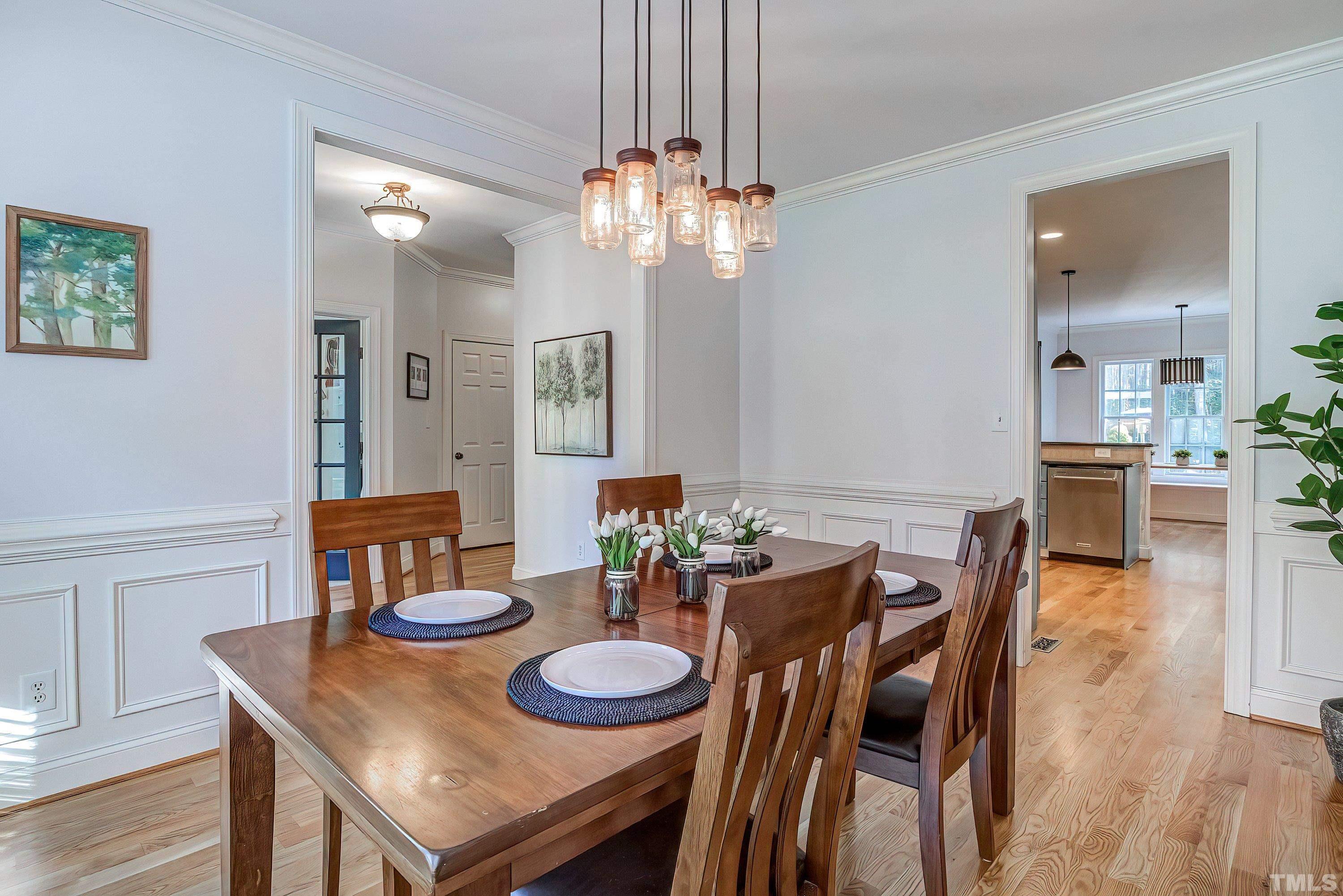 1613 Strategy Way Wake Forest, NC 27587 - Photo 6 of 58 a view of a dining room with furniture and wooden floor