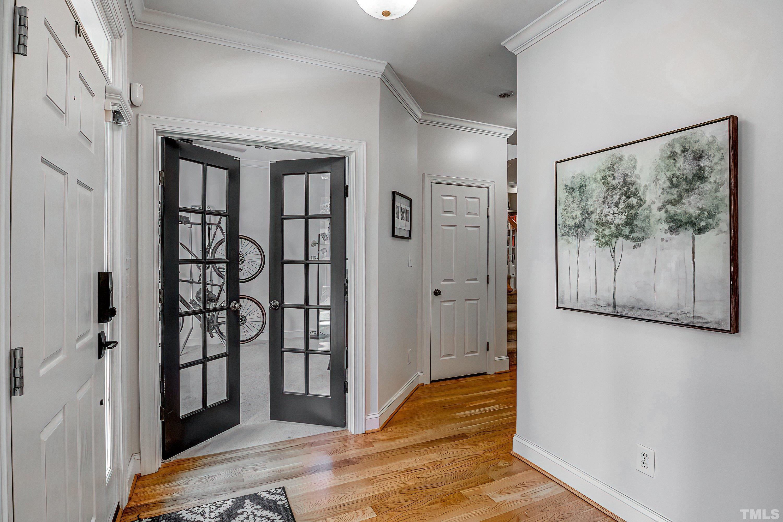 1613 Strategy Way Wake Forest, NC 27587 - Photo 7 of 58 a view of a hallway with wooden floor and closet