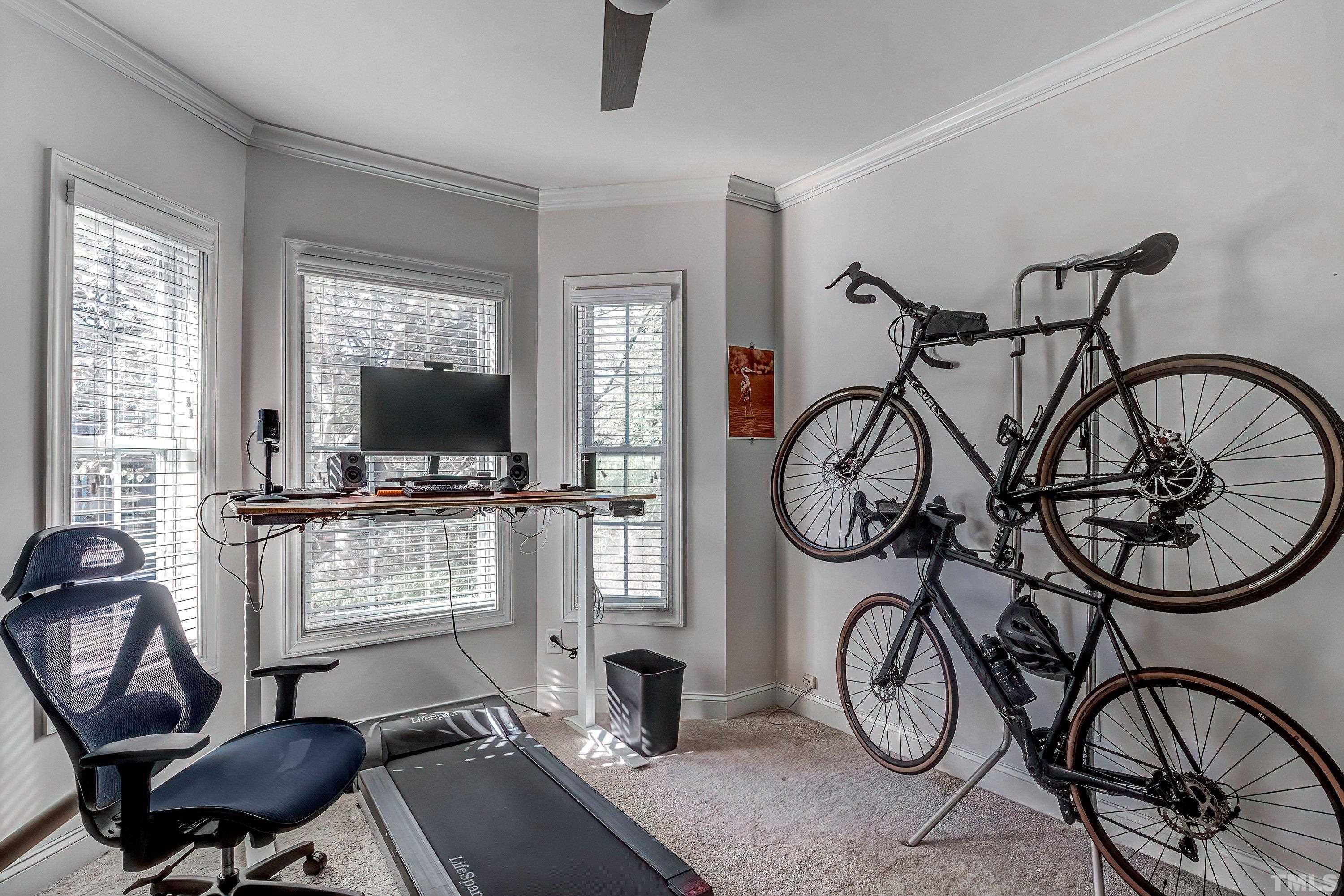 1613 Strategy Way Wake Forest, NC 27587 - Photo 9 of 58 a living room with multiple furniture and a window