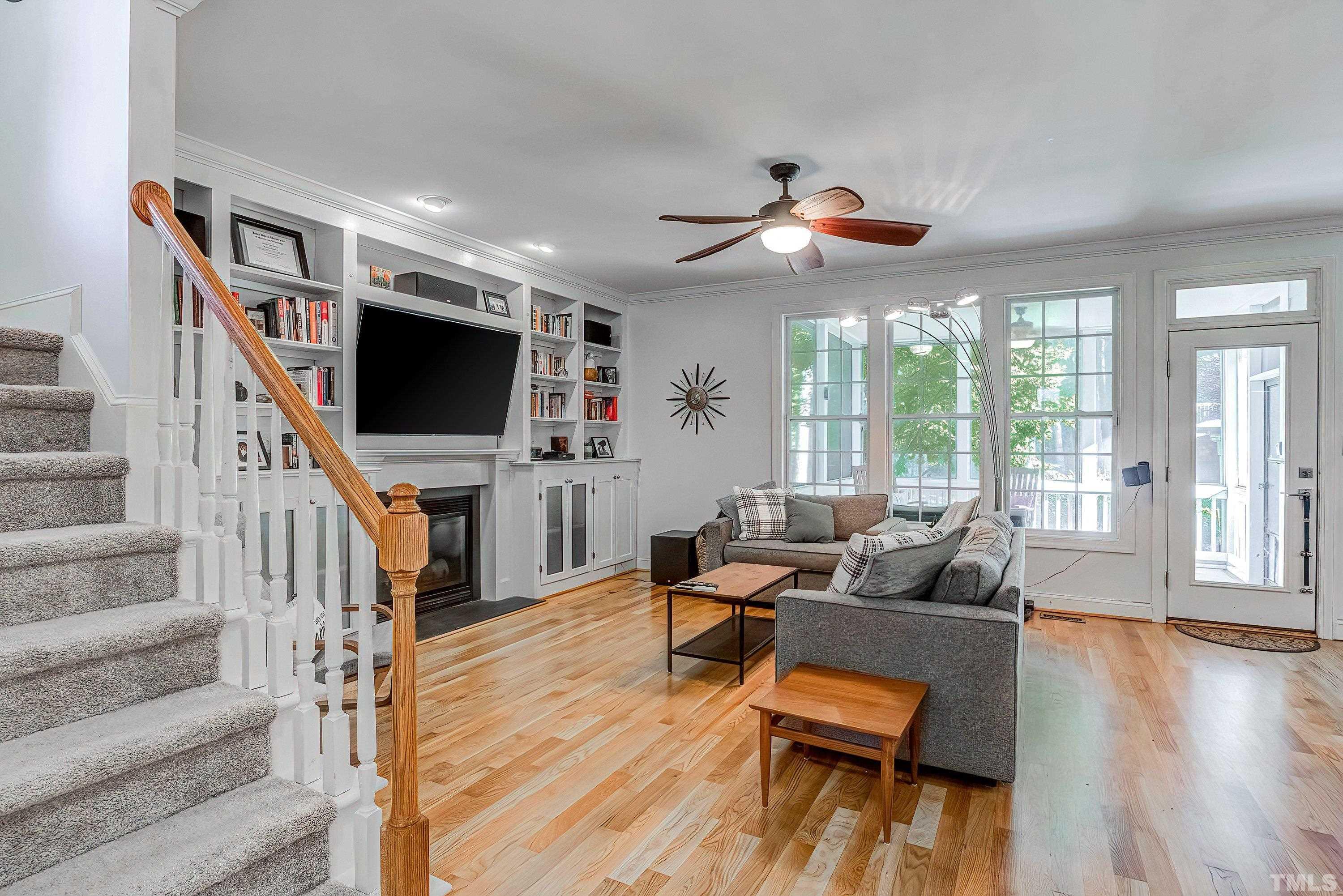 1613 Strategy Way Wake Forest, NC 27587 - Photo 10 of 58 a living room with furniture and a flat screen tv