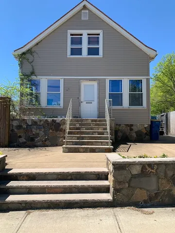 a view of a house with a couches in a patio