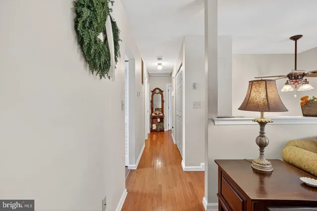 a view of living room with furniture and wooden floor