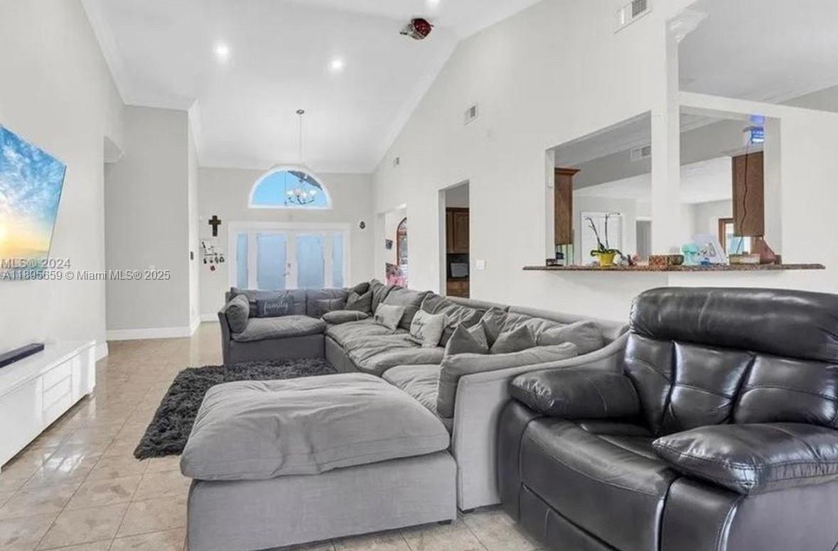 19905 Southwest 135th Avenue Miami, FL 33177 - Photo 12 of 34 a living room with furniture and a large window