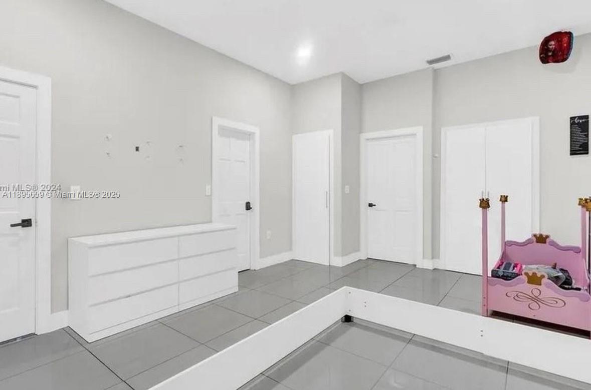 19905 Southwest 135th Avenue Miami, FL 33177 - Photo 20 of 34 a view of room with hardwood