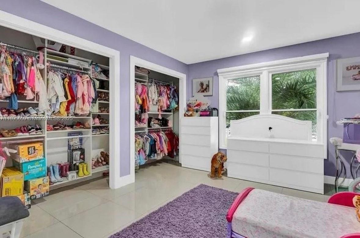 19905 Southwest 135th Avenue Miami, FL 33177 - Photo 22 of 34 a bed room with a bed and a window