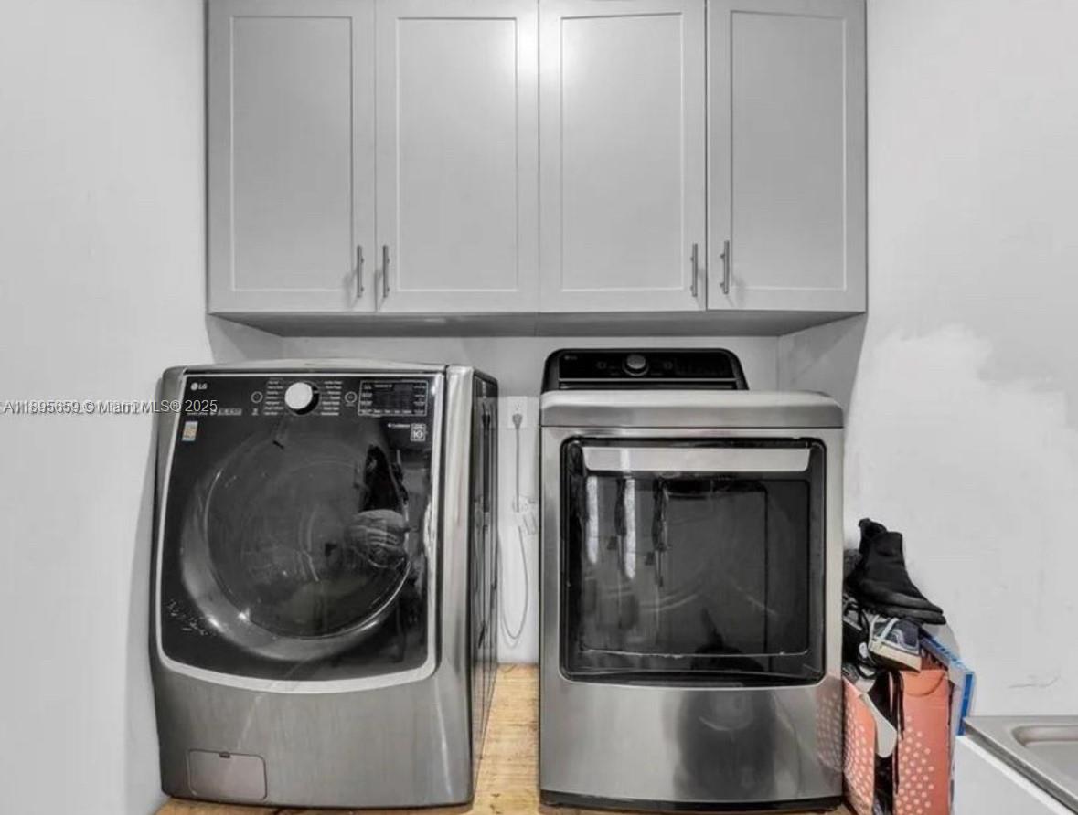 19905 Southwest 135th Avenue Miami, FL 33177 - Photo 26 of 34 a utility room with a washer and dryer
