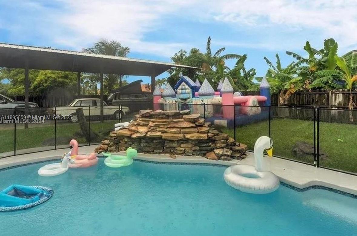 19905 Southwest 135th Avenue Miami, FL 33177 - Photo 29 of 34 a view of a chairs and table in backyard