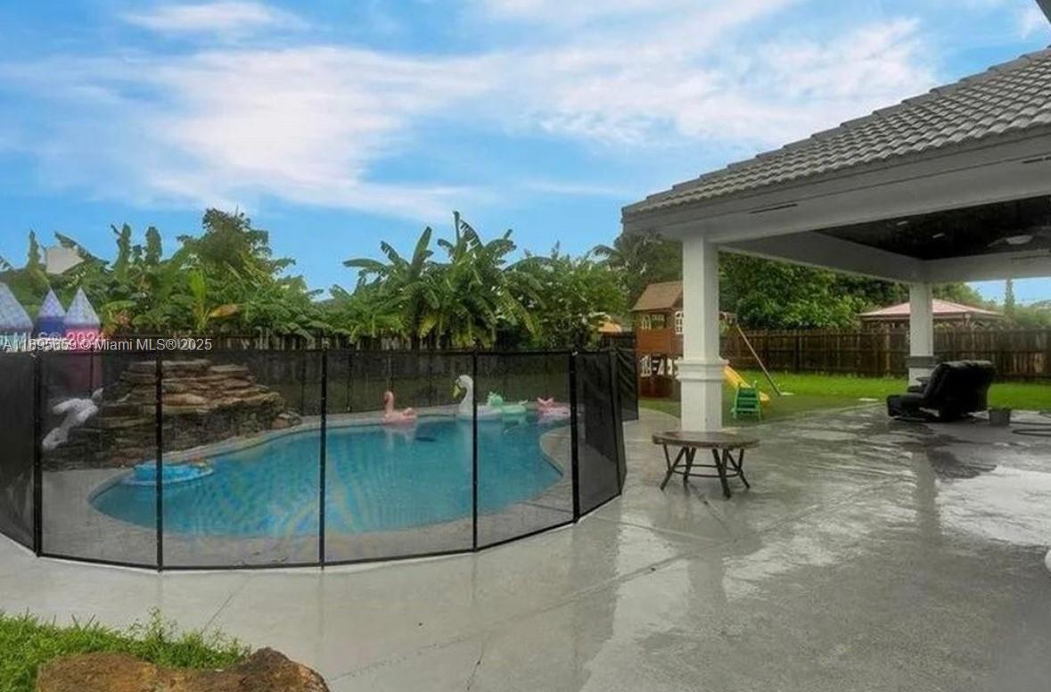 19905 Southwest 135th Avenue Miami, FL 33177 - Photo 30 of 34 a view of a chairs and table in the patio