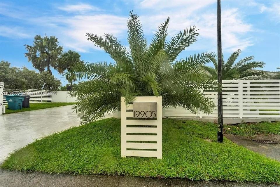 19905 Southwest 135th Avenue Miami, FL 33177 - Photo 3 of 34 a front view of a house with a yard