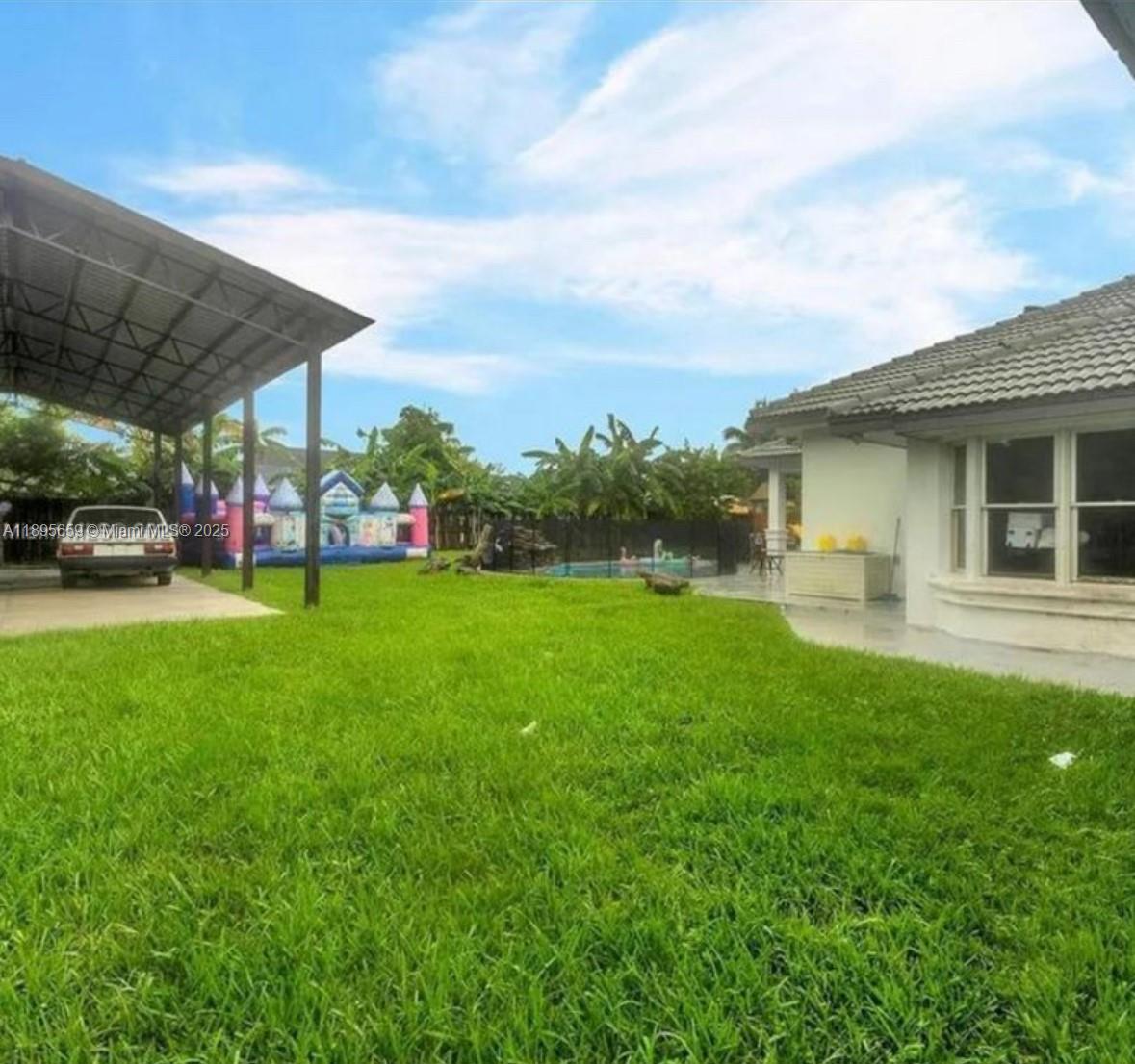19905 Southwest 135th Avenue Miami, FL 33177 - Photo 32 of 34 a view of outdoor space yard and porch