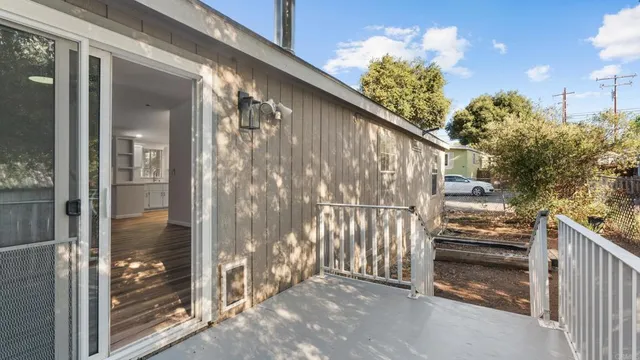 a view of a house with a tree